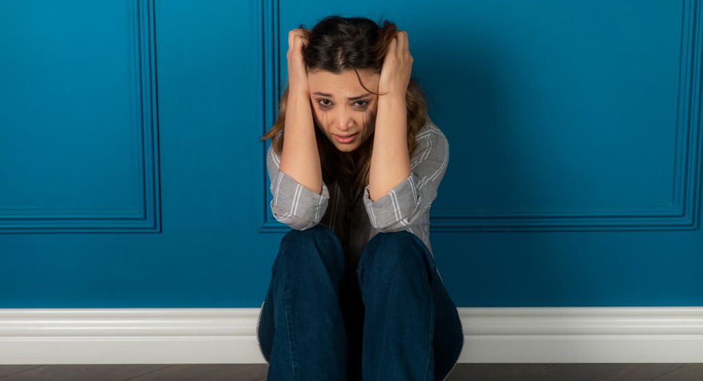 Woman experiencing symptoms of a panic or anxiety attack
