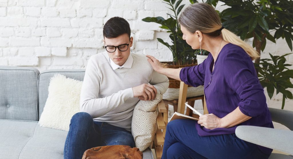 Mental health professional supporting a patient during psychiatric rehabilitation